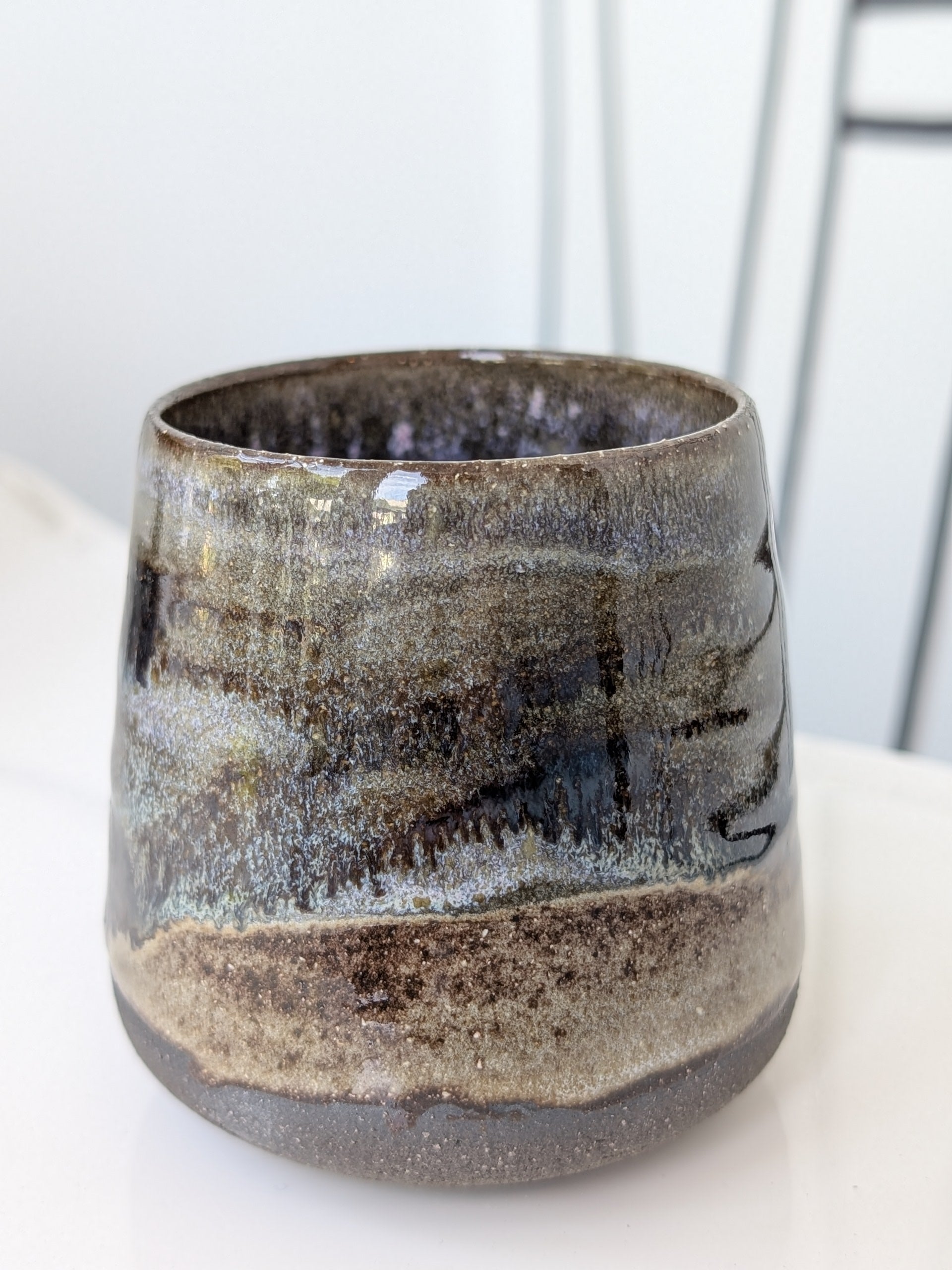 Ceramic mug with textured surface on a white background
