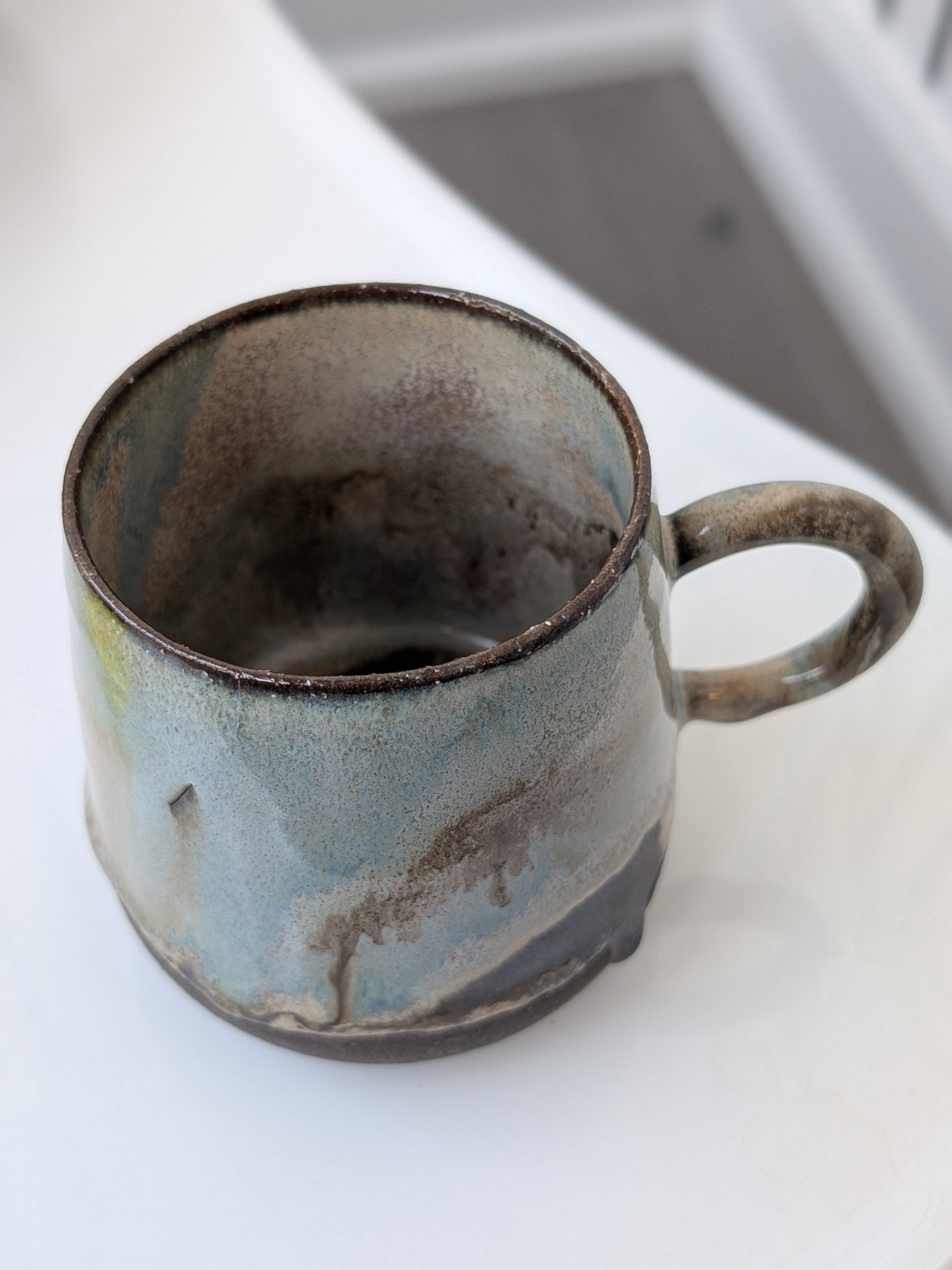 Ceramic mug with a textured surface on a white background