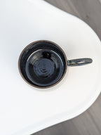 Handmade blue and brown glazed ceramic cup, top view
